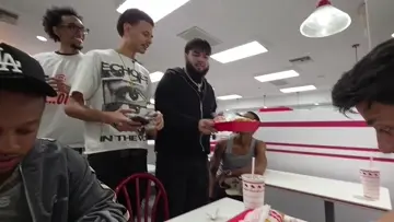 cameraman tries eating and gets WHOOPED