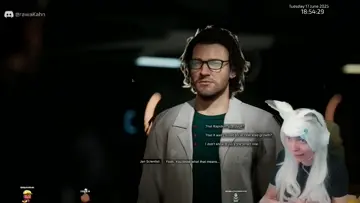 DGN tries to scratch the scientist's ear