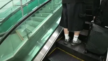 Suitcase falling down escalator (first day stream)