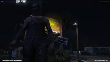 Wee Wee looks at sign