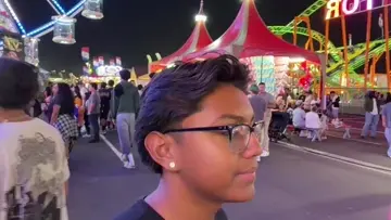 Aldo gets a kiss on the cheek at the OC fair
