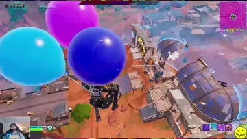 trying to win the match floating with balloons