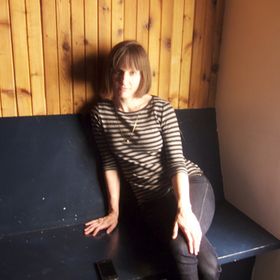 Laura E.