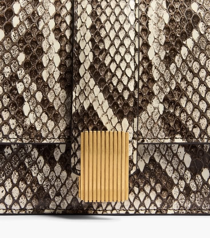 Fine Thing: The “Blake” clutch in python. 
#khaite
