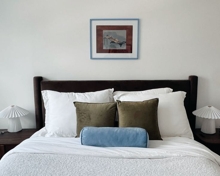 Warm, moody, luxurious bedroom design  - featuring light blu