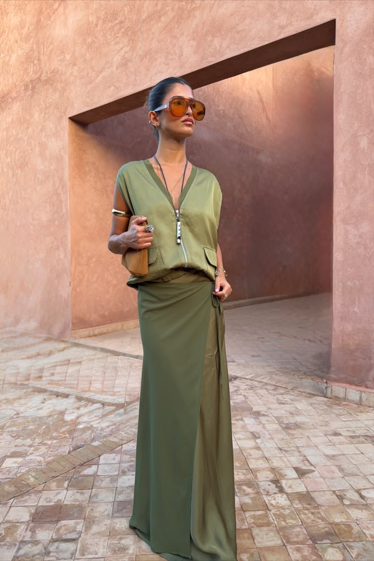 A wrap effect midi skirt in tonal olive green, a satin base 