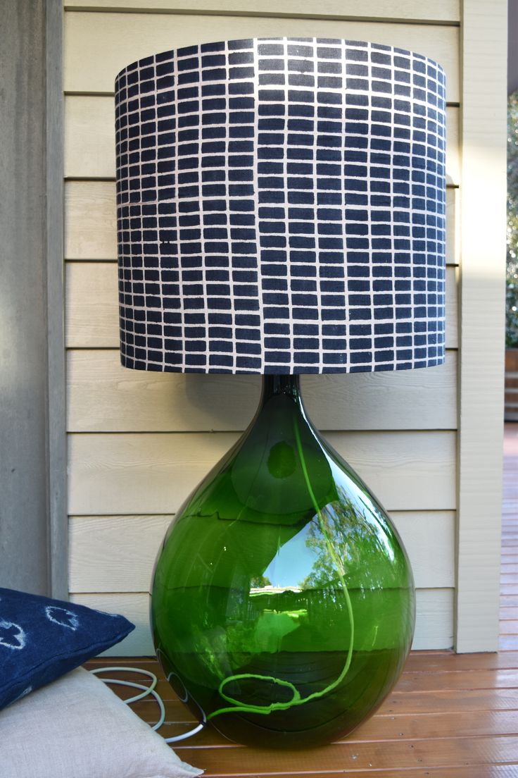 Large vibrant green vintage demijohn lamp.  Stands at one me
