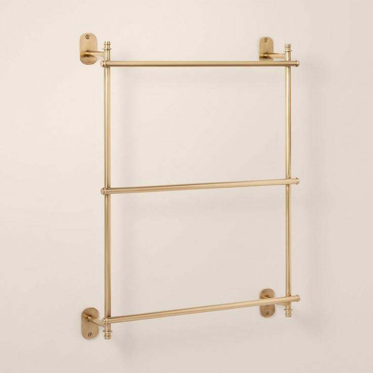 Organize your bathroom towels in style with this Wall-Mounte