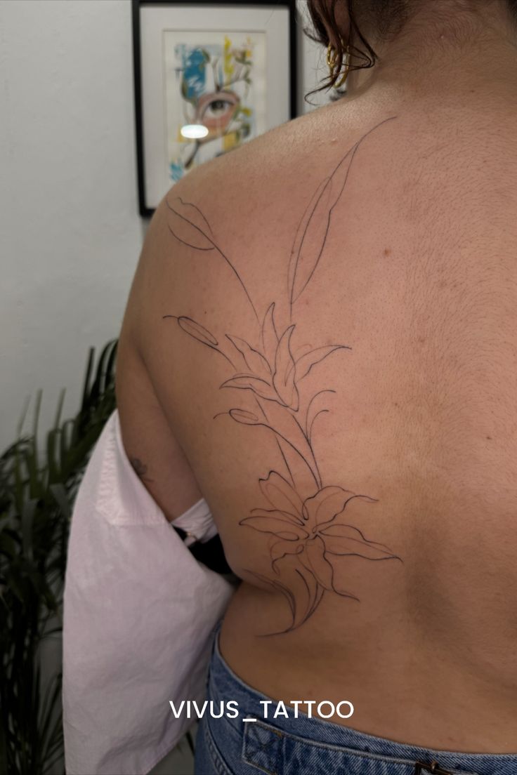 fineline back tattoo for women