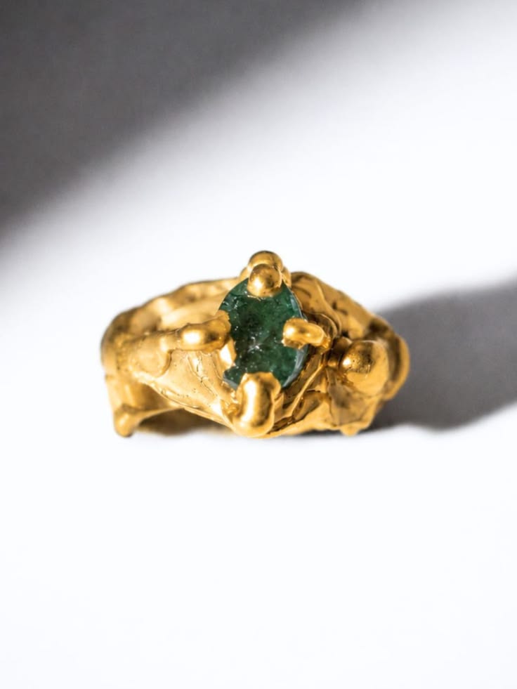 One-of-a-kind ring set with a deep green oval natural emeral