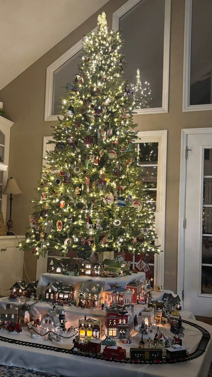 We display our Snow village under our Christmas tree.