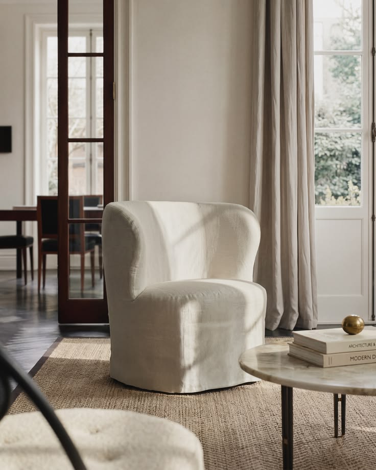 The Stay Slipcover Lounge Chair from GUBI introduces a softe