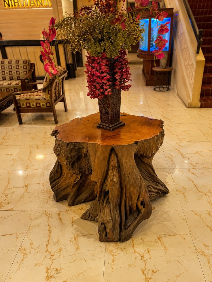 Crafted from a single piece of solid teak wood, this root ta