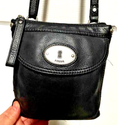 The rich black leather provides a classic look that pairs we