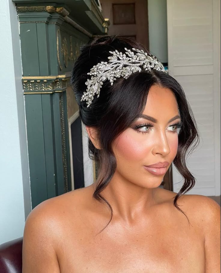 Elevate your bridal look with this stunning updo adorned by 