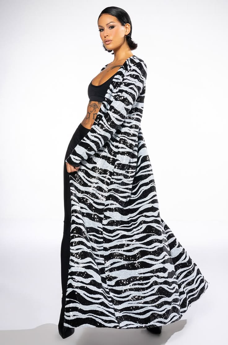 The AKIRA Label On Safari Zebra Sequin Duster is made from a