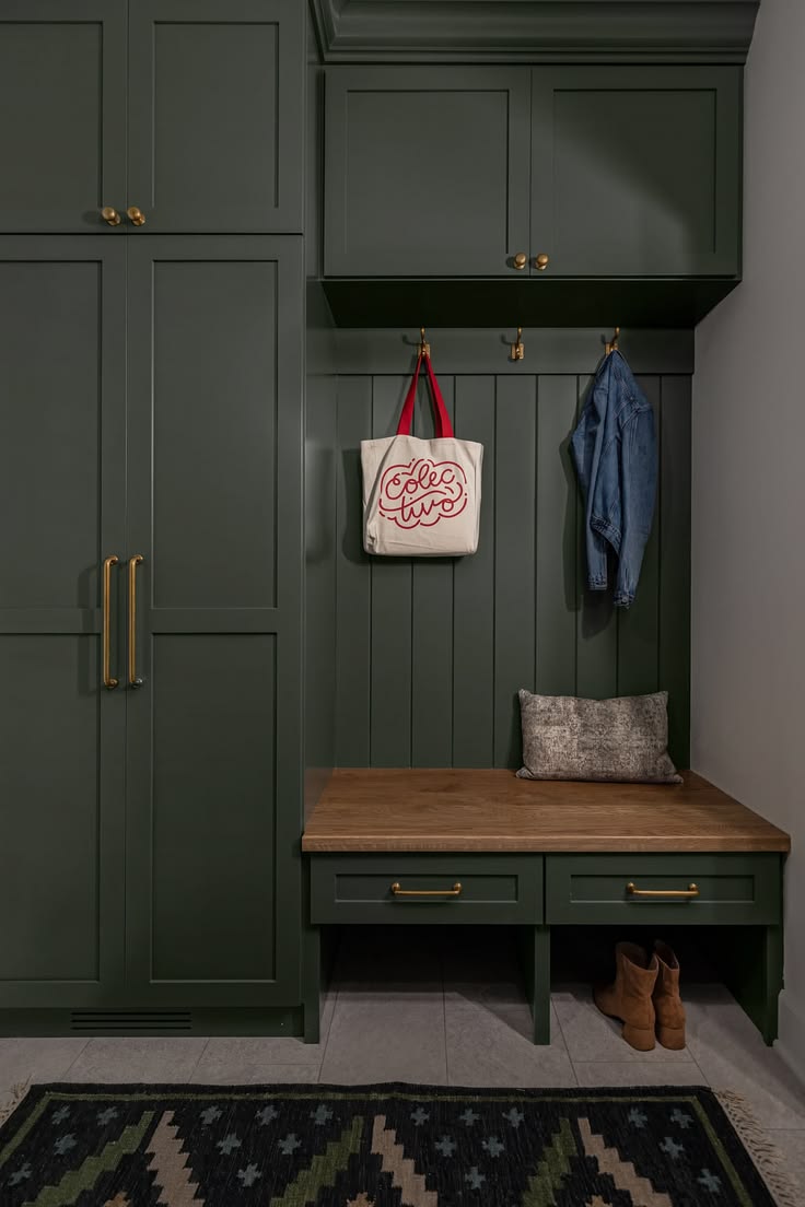 Built in bench, built in storage, green cabinets, brass hard