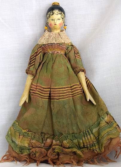 This 9 inch tall doll, circa the early 19th century, was man