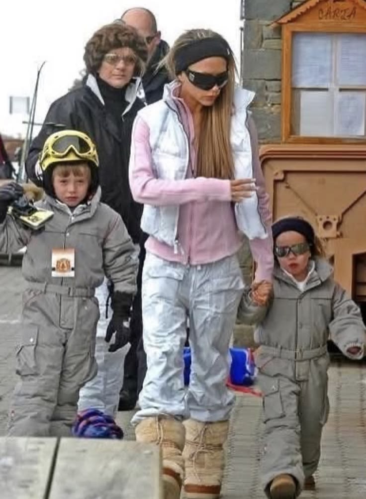 Victoria Beckham in a chic ski outfit with moon boots, a whi