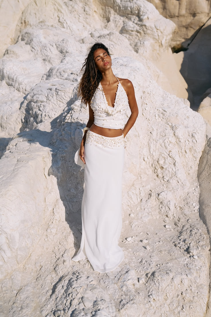 The cowl-neck shell top, and she's a showstopper. A softly d