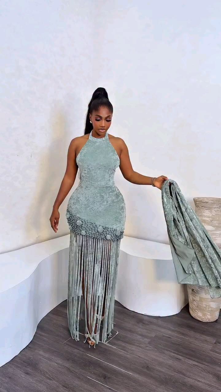 Turn heads in this stunning fringe-detail evening gown featu