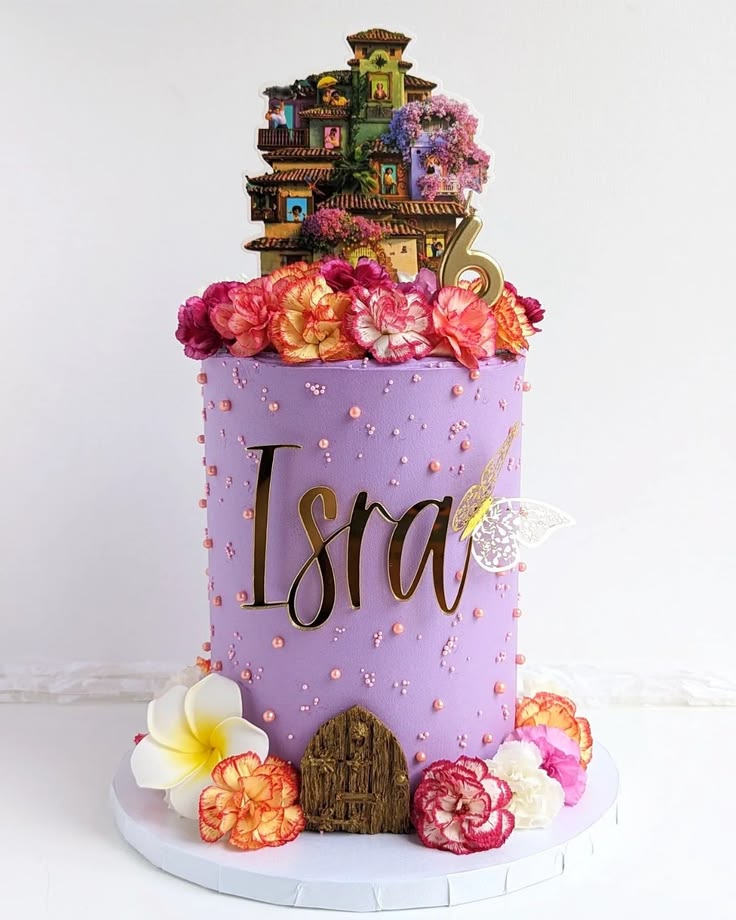 This tall purple Encanto cake features the Madrigal Casita, 