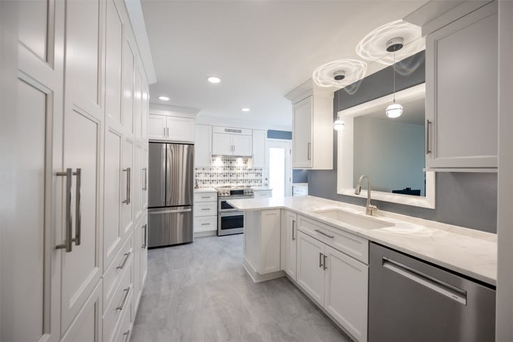 This kitchen pairs crisp custom cabinetry with elegant quart