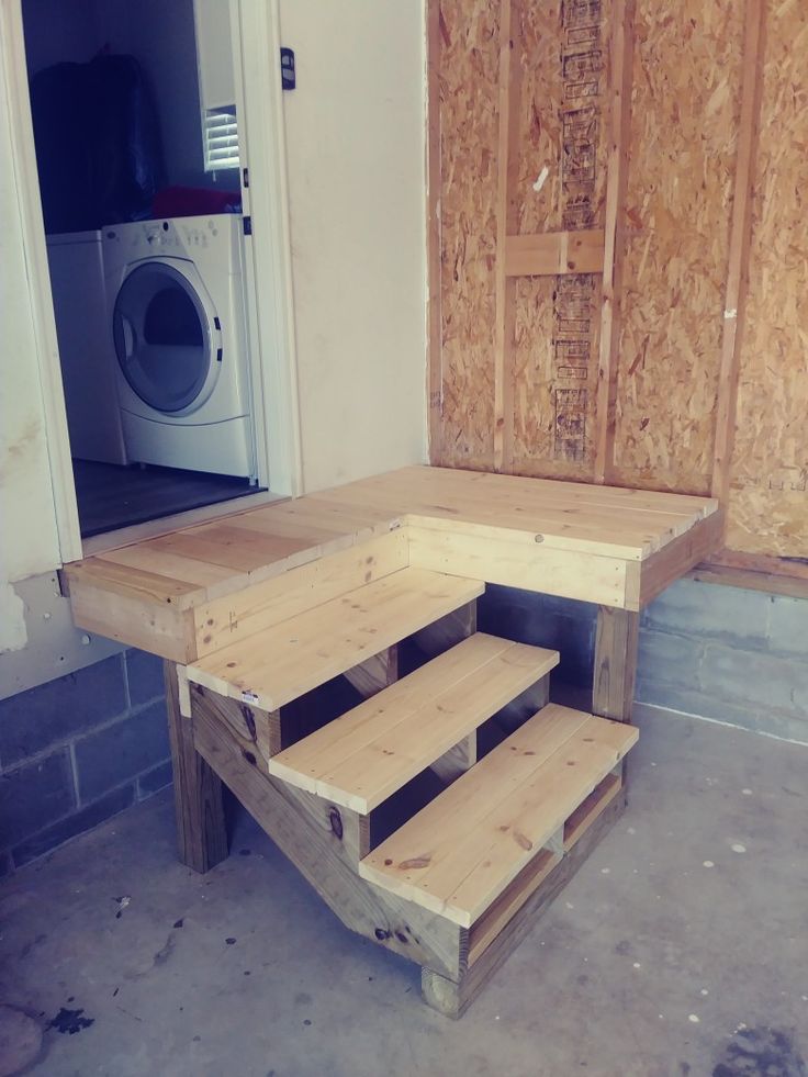 Garage entry to laundry room with storage deck.