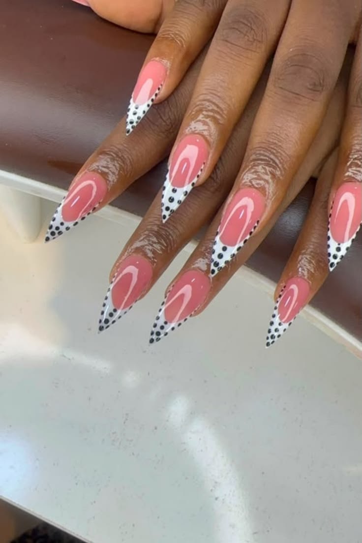 Coral pink with polka dot french tips on dark skin is the mo