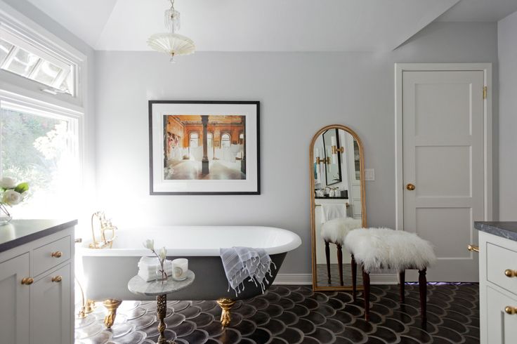 Both the marble side table and the Art Deco light fixture ar