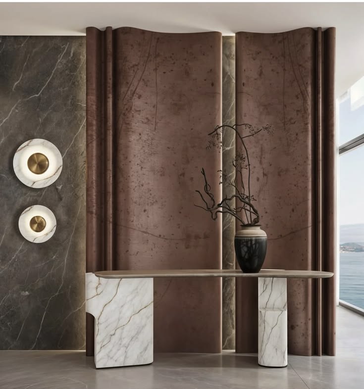 Bespoke foyer entryway design featuring curved metallic terr