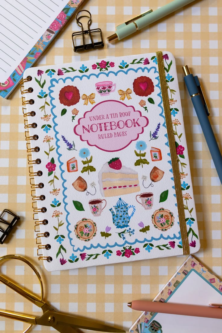 Whimsical spiral notebook with hand-illustrated teacups, cak