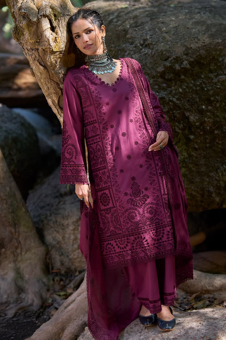 Bold and expressive in a rich berry red tone, this unstitche