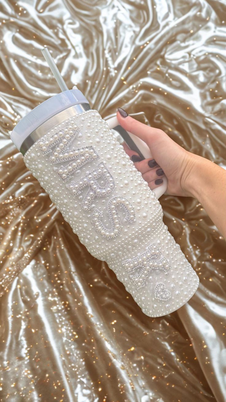 Sip in style with our luxurious pearl-covered "MRS" tumbler,