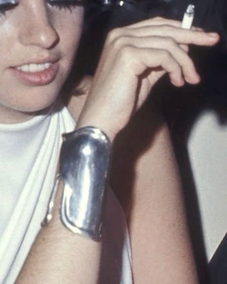 Liza Minnelli wearing silver “bone cuffs” by Elsa Peretti