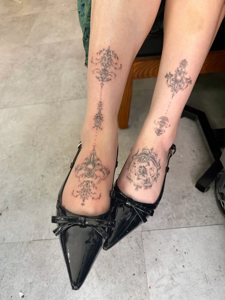 Two matching tattoos inspired by victorian styla ornamentals