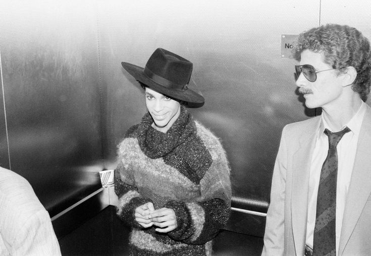 In 1986, Prince arrives at London Gatwick Airport for the fi