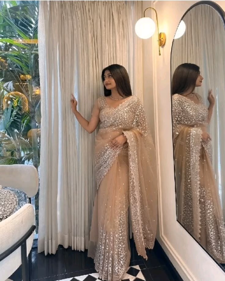 Shine effortlessly in this gorgeous champagne sequin saree f