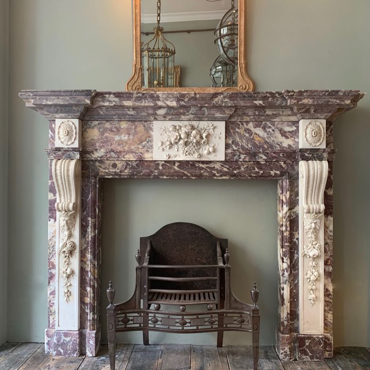 A rare and unusual George II, Palladian fireplace in variega