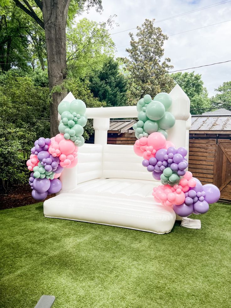 Add balloons to The White Bounce House to match any party or