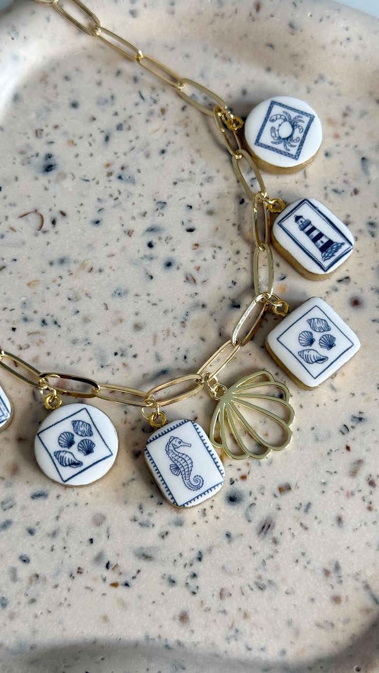 My charm necklaces are now available on our Etsy shop (link 