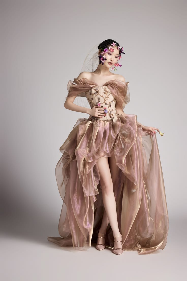 Iridescent gold and rose-colored glass organza gown worn wit