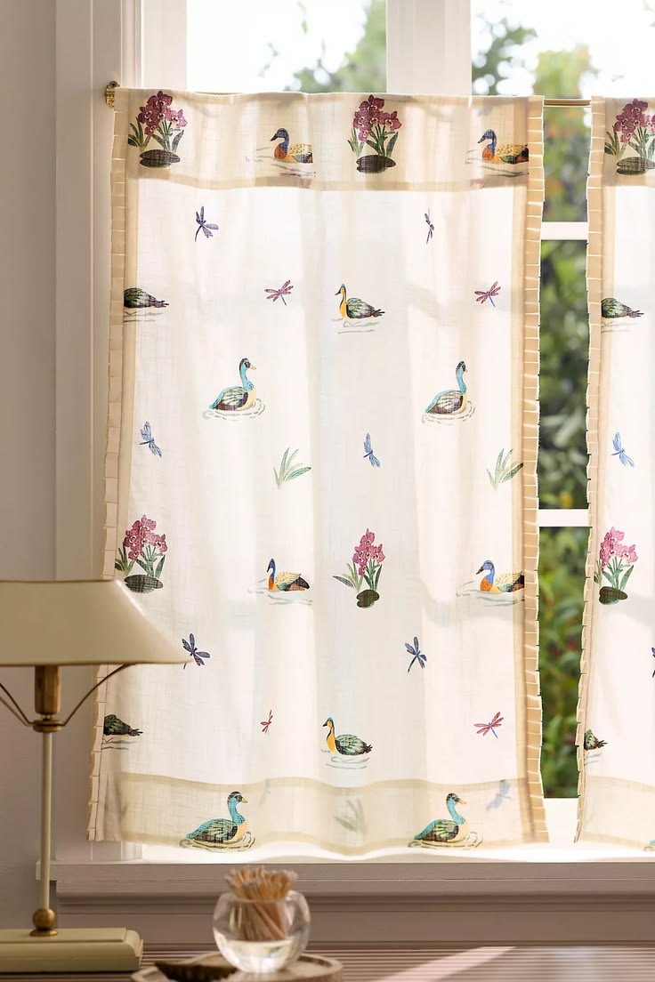 A playful illustrated cafe curtain adds personality without 