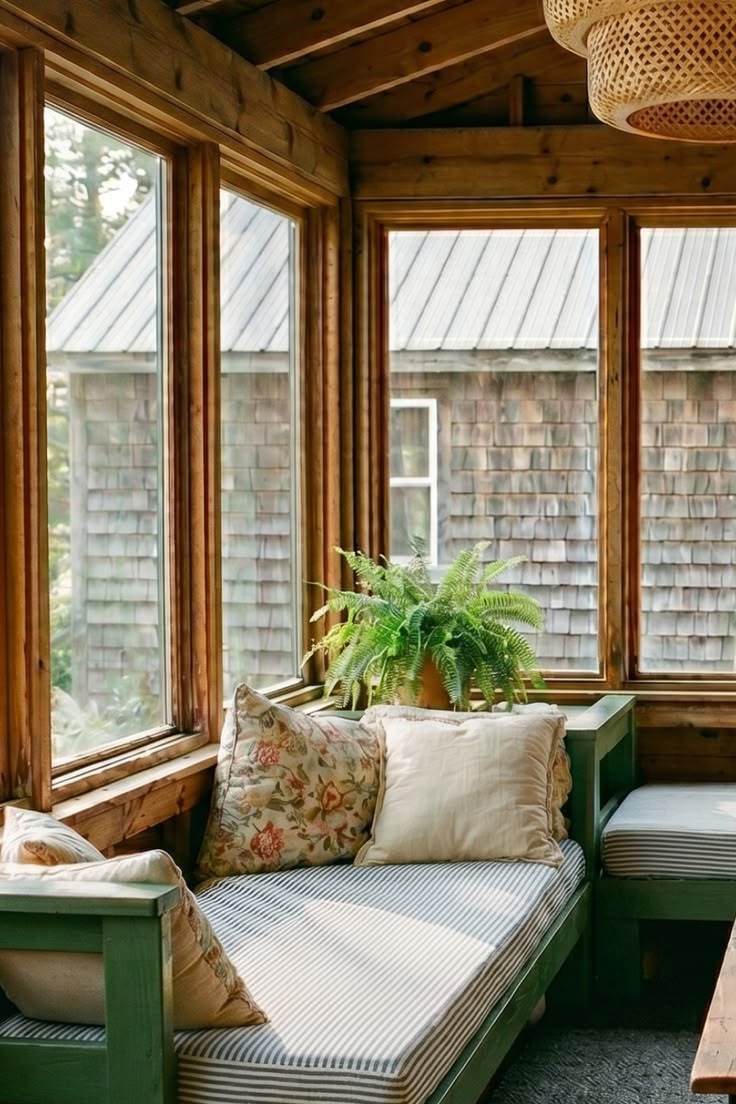 A built-in bench seat, a fern catching the breeze, and the s