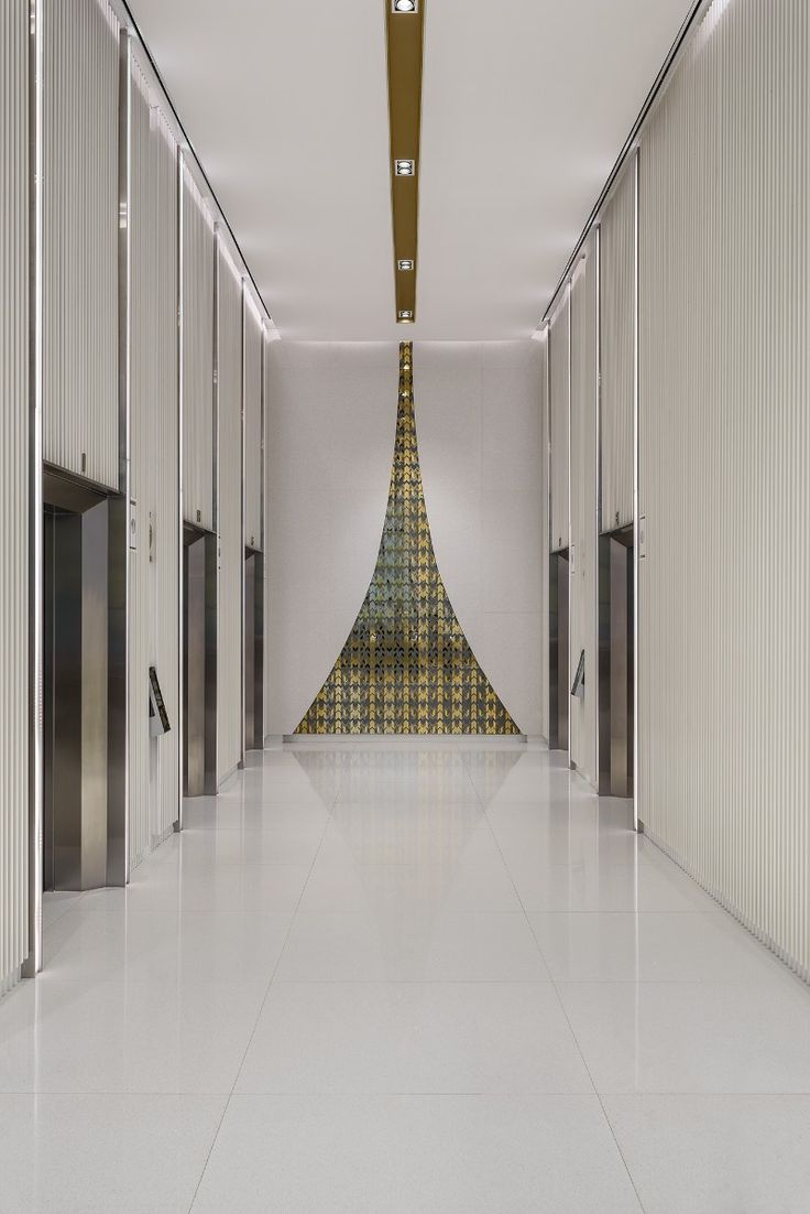 The combination of silver and ecru with mirror brass is unex