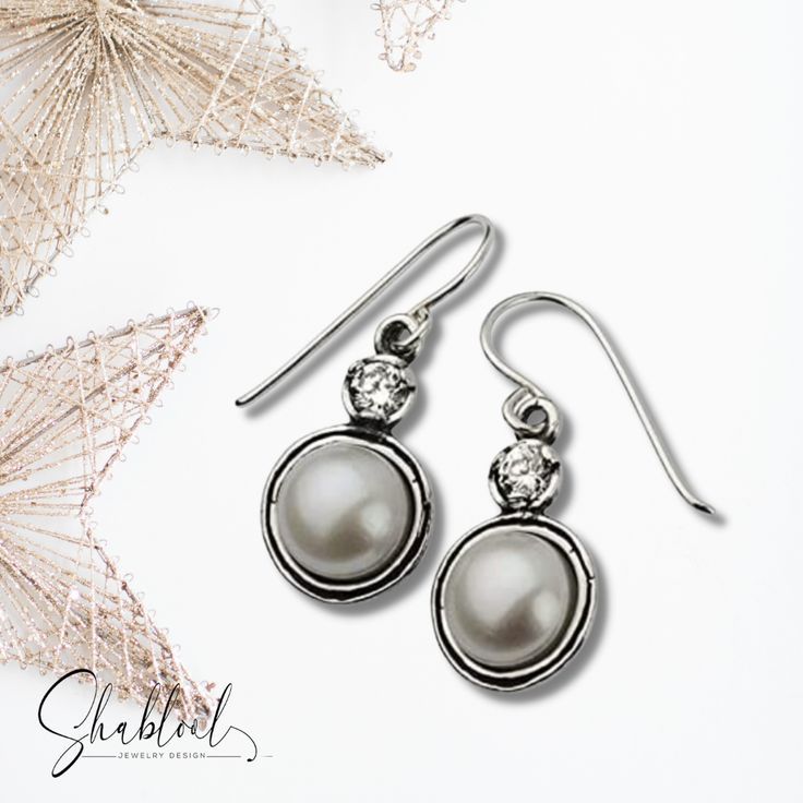 These delicate drop earrings are made with White Fresh Water