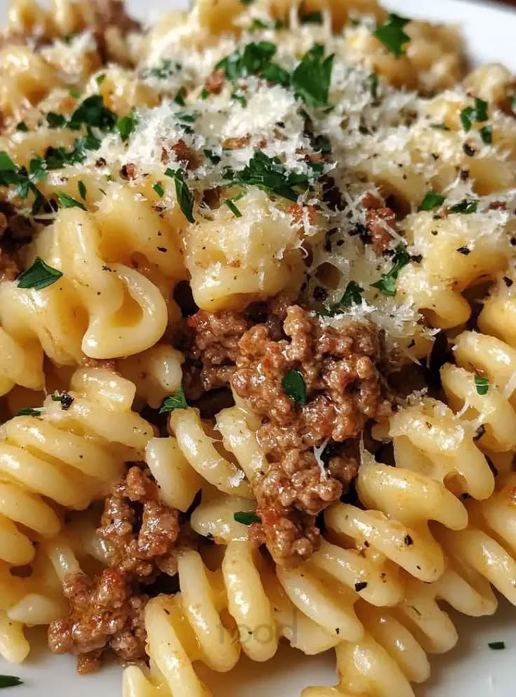 A creamy and savory dish featuring rotini pasta, ground beef