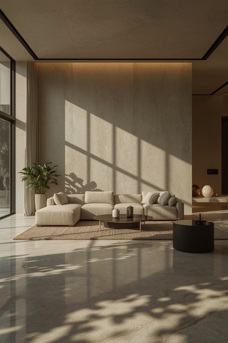 A spacious minimalist living room defined by soft textures, 