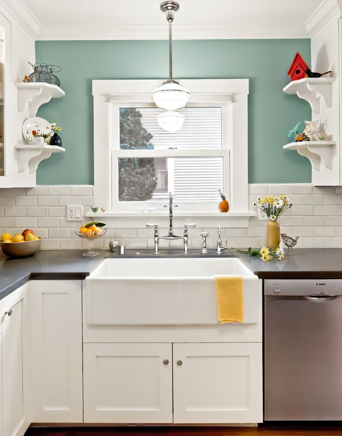 white cabinets, dark counter, great wall color.