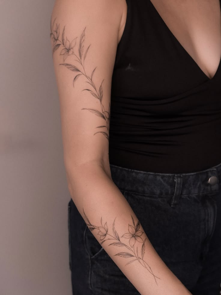 A delicate jasmine branch flowing along the arm, created in 